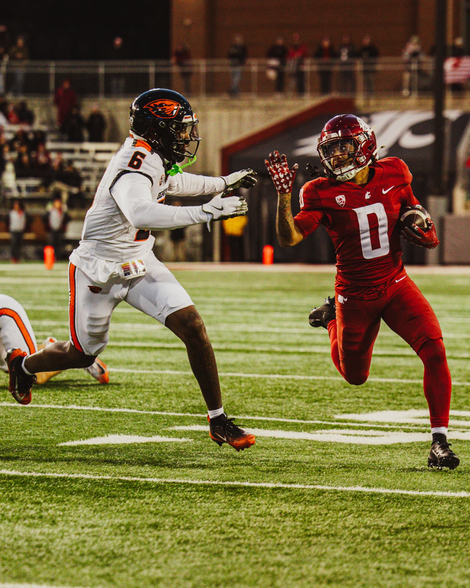 Washington State receiver breaking away down the sideline